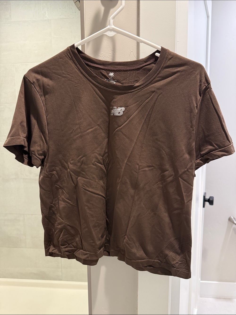 New Balance women’s workout Brown Short Sleeve Performance Tee